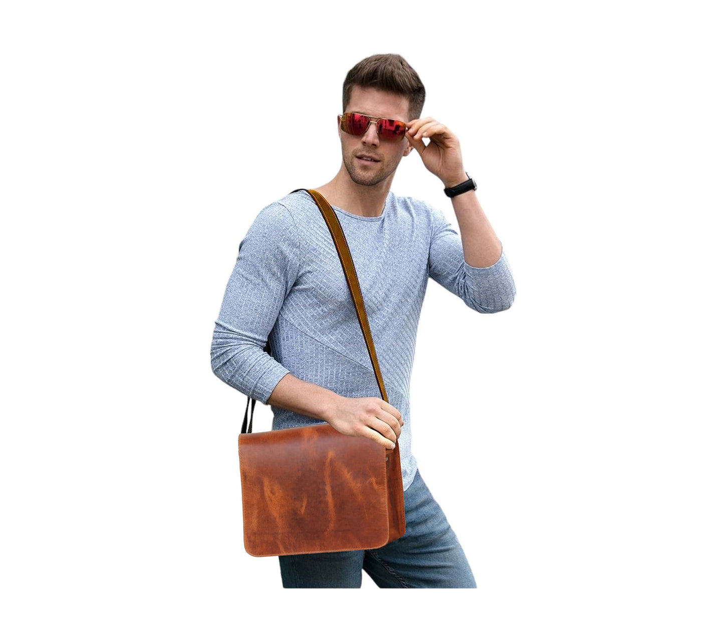 This Image Features A Stylish Man Confidently Modeling Handcrafted Leather Messenger Bag, Worn Crossbody For Modern, Casual Look. The Rich Tan-brown Full-grain Adds Rugged Yet Refined Touch, Making It Standout Accessory Against His Laid-back Outfit Of Light Knit Sweater And Jeans. Bag’s Structured Shape Smooth Finish Highlight Its Quality Craftsmanship, While Adjustable Shoulder Strap Ensures Comfort During Daily Use. Perfect Work, Study, Or Travel, Versatile Bag Makes Thoughtful Personalized Gift Men—ideal