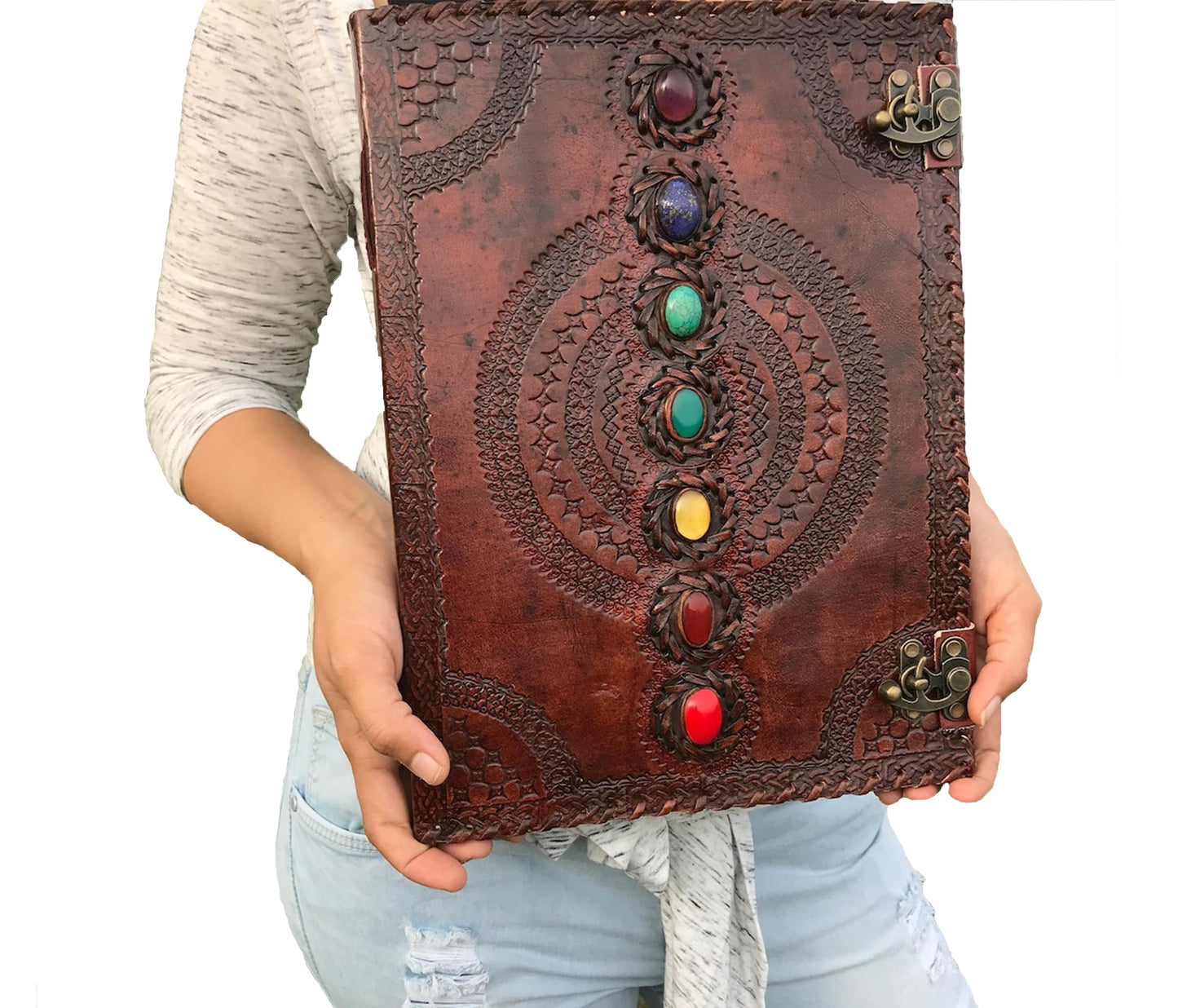 This Image Features A Beautifully Handcrafted Leather Chakra Journal Adorned With Seven Vibrant Gemstones, Each Representing The Chakras. Intricate Hand-embossed Patterns, Combined Dual Antiquated Metal Clasps, Give It Mystical And Vintage Charm. Ideal For Use As Spiritual Diary, Yoga Journal, Meditation Log, Or Wiccan Grimoire, Unique Piece Blends Healing Energy Artisan Craftsmanship. Rich Brown Detailed Gemstone Inlay Make Both Functional Decorative Item. Perfect Balancing, Healing, Gift Seekers.
