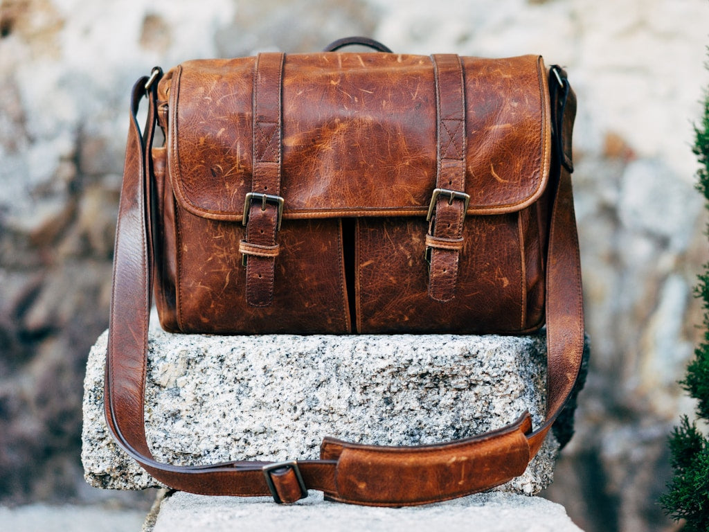 Aged full-grain leather wallet showing rich dark patina from years of use
