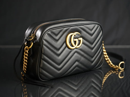 New brown leather bag being broken in on a wooden surface in warm natural light