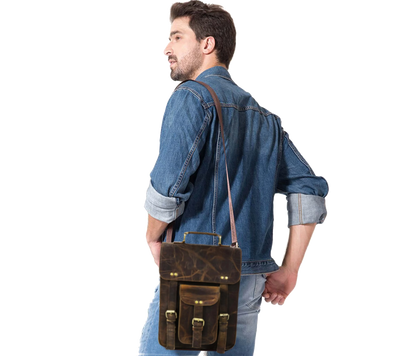 This Image Features A Man Stylishly Showcasing Premium Leather Crossbody Bag, Highlighting Its Everyday Versatility And Sleek, Professional Appeal. Worn Comfortably Over The Shoulder, It Demonstrates An Adjustable Strap Ideal For Both Casual Semi-formal Wear. Dark Brown Distressed Finish Offers Rugged Yet Refined Look, While Compact Design Ensures Ease Of Movement. Customized, Personalized Gift Men—perfect Carrying Essentials Like Tablet, Phone, Wallet, Or Notebook. Birthdays Graduations.