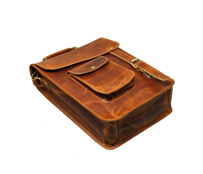 This Angled Flat-lay View Captures The Rugged Elegance Of A Handcrafted Leather Crossbody Bag, Featuring Rich Distressed Tan Finish, Detailed Stitching, And Premium Structure. With Its Gusseted Base, Secure Snap-button Front Pocket, Solid Brass Buckle Strap, It Offers Ample Room For Tablets Essentials. Perfect Personalized Gift Men Women, Makes Thoughtful Birthday, Graduation, Or Customized Everyday Gift—blending Timeless Style Lasting Durability. 