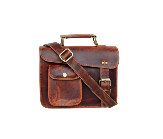 This Image Showcases A Stylish, Compact Leather Messenger Bag Crafted From Rich, Vintage-style Brown Leather. It Features Top Handle For Easy Carrying And An Adjustable Shoulder Strap Hands-free Convenience. The Front Includes Small Flap Pocket With Button Closure Quick-access Items. Concealed Push Lock Beneath Main Adds Security Without Compromising Style. Finished Brass Hardware Detailed Stitching, Customized Makes Perfect Personalized Gift Men Women—ideal Birthdays Or Graduations.