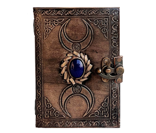 Channel Ancient Energy With This Handcrafted Leather Journal, Featuring A Burnished Metallic Finish And An Intricately Embossed Triple Moon Design. Centered By Deep Blue Gemstone, The Cover Evokes Celestial Power Spiritual Depth. Journal Is Secured Vintage Brass Latch, Offering Both Elegance Protection For Your Private Thoughts. Expertly Hand-stitched Steeped In Gothic Charm, Piece Perfect Witches, Wanderers, Dreamers Alike. Whether Used As Grimoire, Diary, Or Art It Invites Magic To Every Page. 