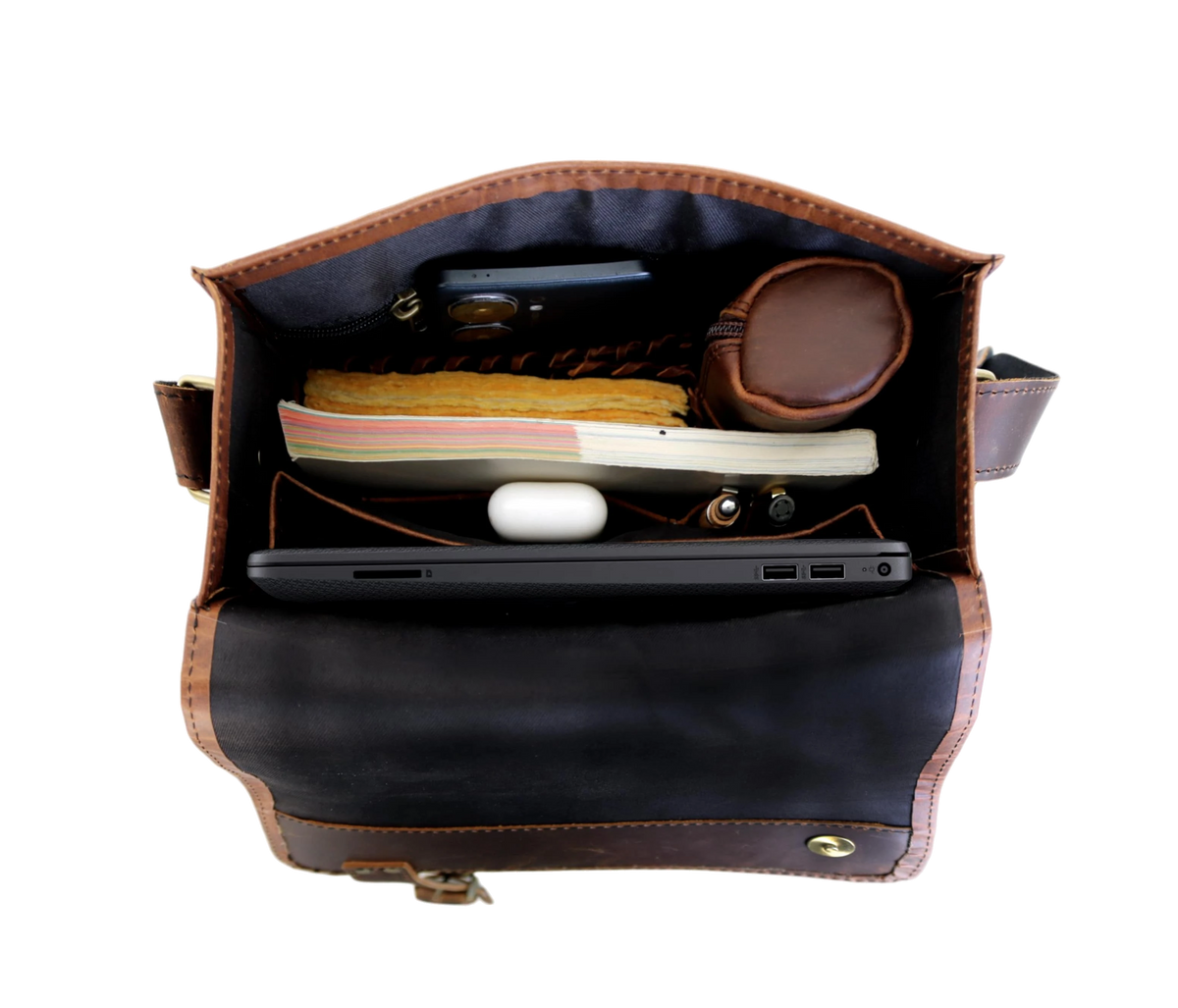 This Image Showcases The Interior Of A Leather Crossbody Bag, Revealing Its Well-organized And Spacious Design. Crafted For Everyday Functionality, It Neatly Accommodates Essentials Like Notebook Or Journal, Slim Tablet Laptop, Wireless Earbuds. Additional Compartments Securely Hold Smartphone, Medicine Pouch, Writing Instruments In Dedicated Pockets Sleeves. Thoughtful Layout Strikes Perfect Balance Between Functionality Compactness, Making An Ideal Personalized Customized Gift Men And Women