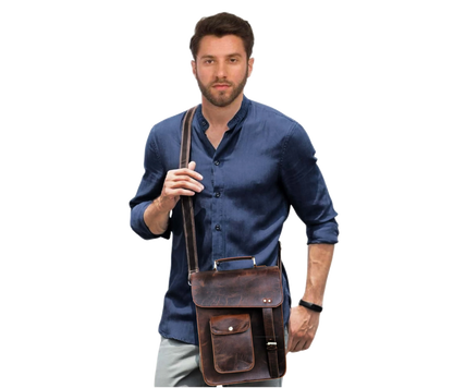 This Image Showcases A Man Wearing Stylish, Vintage-inspired Leather Crossbody Bag Crafted From Distressed Buffalo Leather, Giving It Rugged, Classic Look. The Features Flap Closure With Metallic Studs And Buckle Strap For Added Security. Front Includes Convenient Quick-access Pocket, Ideal Items Like Keys Or Wallet. Adjustable Shoulder Ensures Comfortable Wear, While Overall Size Design Make Perfect Daily Essentials, Travel, Casual Outings