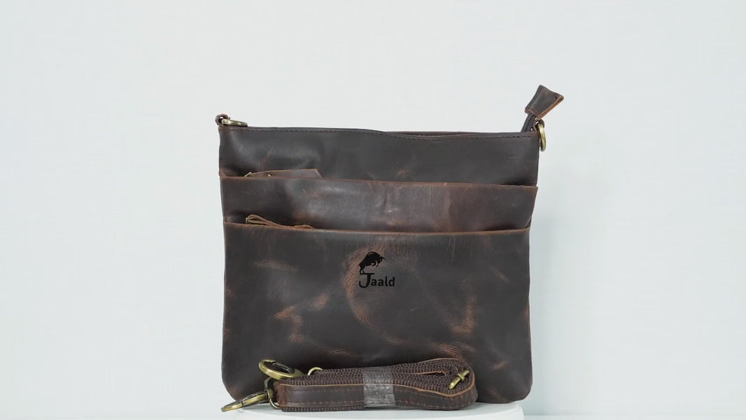 This Slim Leather Crossbody Bag From Jaald Is Crafted From Genuine Buffalo Leather, Featuring A Rich, Distressed Finish For A Vintage Look. Lightweight And Compact, It Offers Multiple Zipper Compartments For Organized Storage Of Essentials Like A Phone, Wallet, Or Keys. With A Detachable, Adjustable Strap For Comfortable Wear, This Stylish Yet Practical Bag Makes A Perfect Personalized Gift For Men And Women—ideal For Travel, Errands, Birthdays, Or Graduation.
